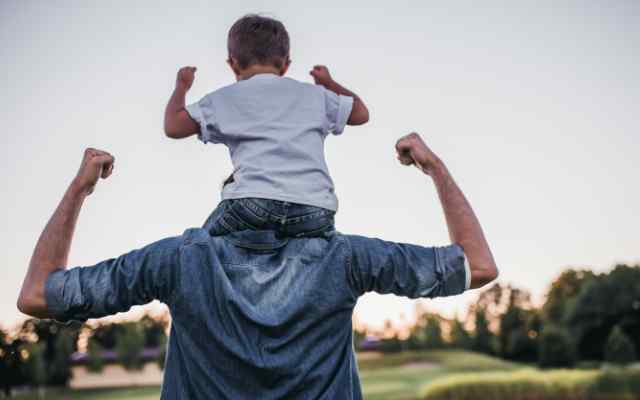 son on dads shoulders