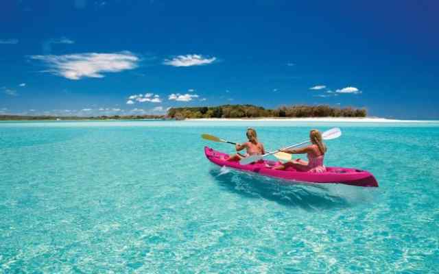 couple kayaking on water 